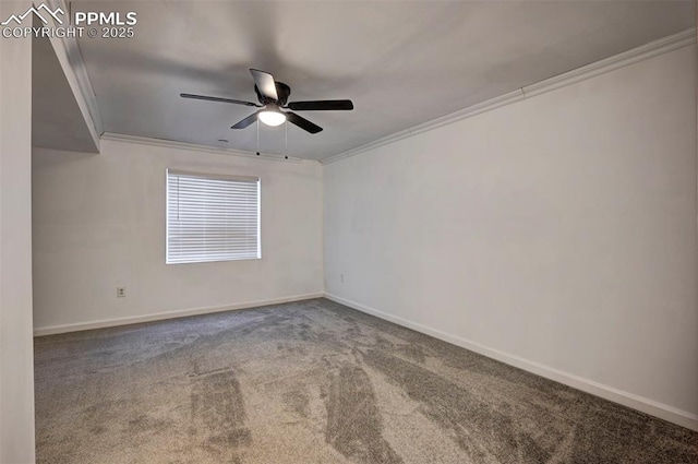 carpeted spare room featuring ceiling fan and ornamental molding