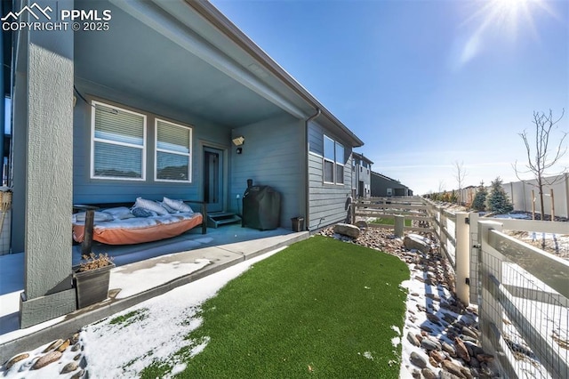 view of home's exterior featuring a fenced backyard and a lawn