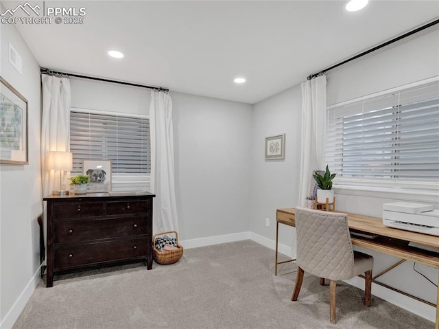 office area featuring light colored carpet