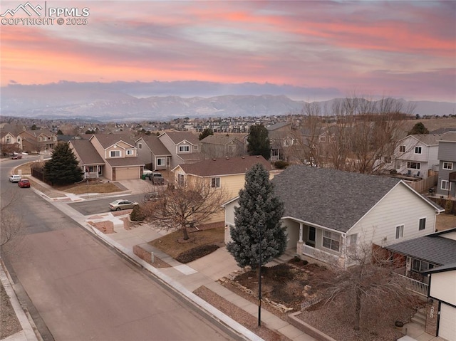 aerial view at dusk with a mountain view