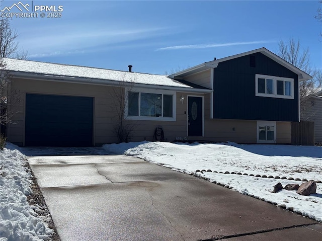 tri-level home featuring driveway and an attached garage