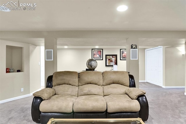 carpeted living area with baseboards and recessed lighting