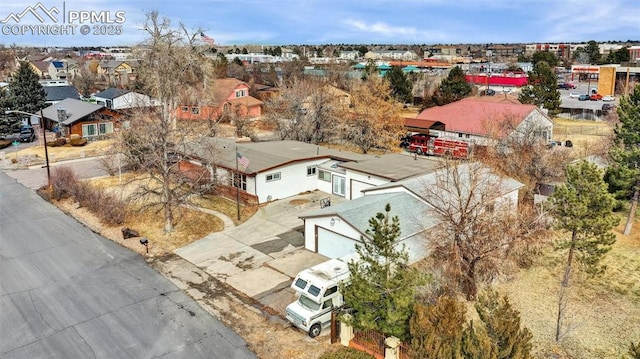 birds eye view of property with a residential view