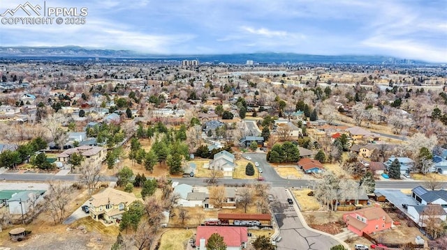 aerial view featuring a mountain view and a residential view