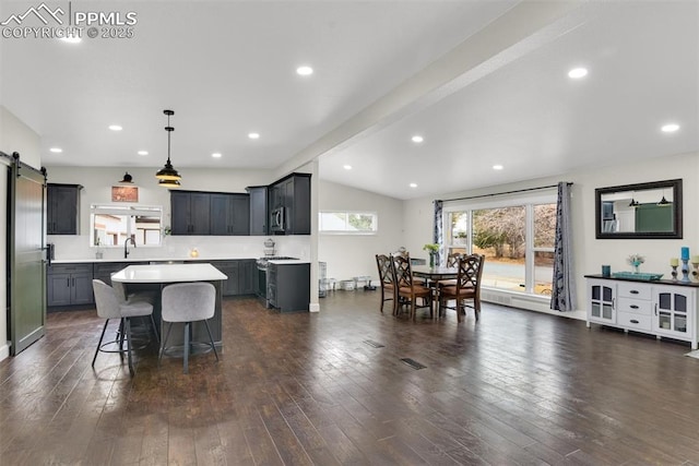 dining area with recessed lighting, visible vents, lofted ceiling with beams, a barn door, and dark wood-type flooring