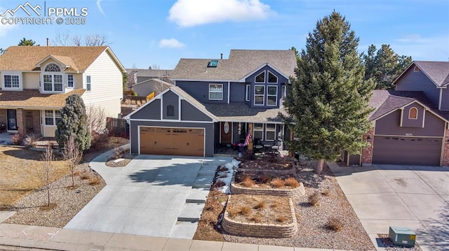 traditional home featuring driveway, a shingled roof, and a residential view