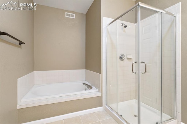 bathroom featuring tile patterned flooring, visible vents, a garden tub, and a shower stall