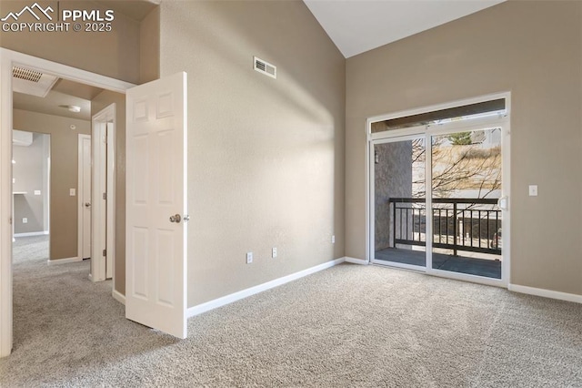 spare room featuring light carpet, visible vents, and baseboards