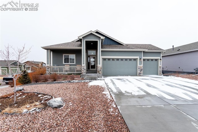 view of front of house featuring a garage and covered porch