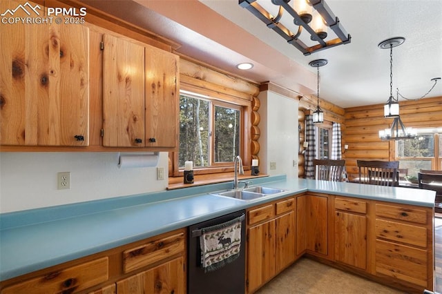 kitchen featuring sink, stainless steel dishwasher, log walls, and pendant lighting