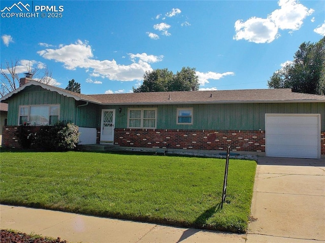 single story home featuring a garage and a front lawn