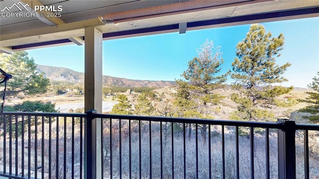 balcony featuring a mountain view