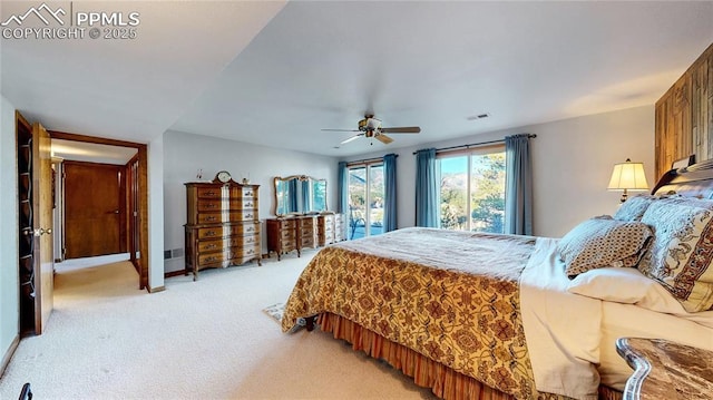 bedroom featuring ceiling fan and light colored carpet