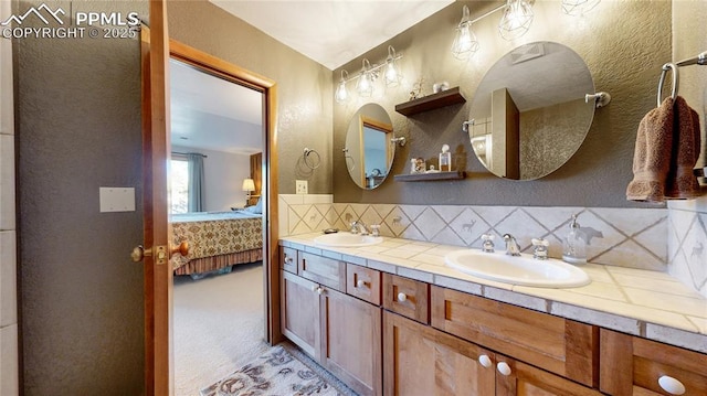 bathroom with backsplash and vanity