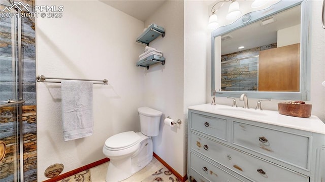 bathroom with toilet and vanity