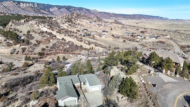 birds eye view of property featuring a mountain view