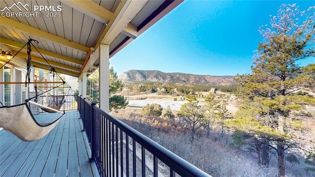 balcony featuring a mountain view