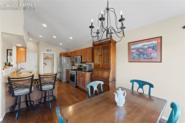 dining space with visible vents, an inviting chandelier, vaulted ceiling, dark wood finished floors, and recessed lighting