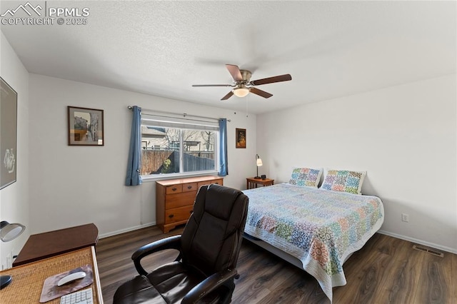 bedroom with dark wood finished floors, baseboards, and visible vents