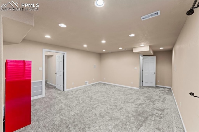 finished basement featuring baseboards, visible vents, recessed lighting, and carpet flooring