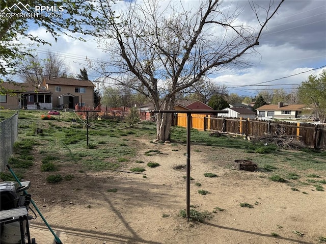 2106 Capulin Dr, Colorado Springs, CO 80910 - view of yard featuring fence and a fire pit