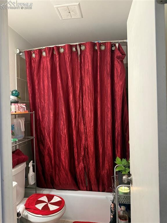 2106 Capulin Dr, Colorado Springs, CO 80910 - bathroom featuring shower / tub combo, toilet, and visible vents