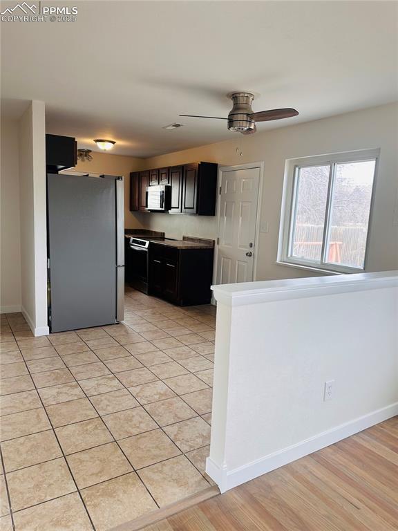 kitchen featuring dark brown cabinetry, stainless steel appliances, and ceiling fan