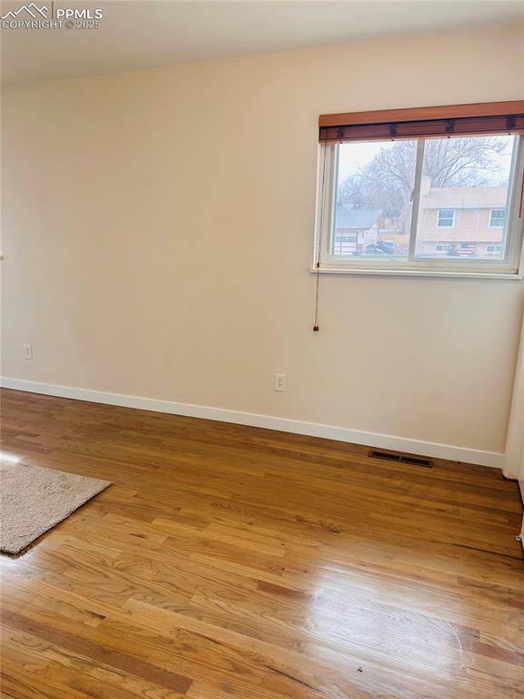 empty room with light wood-type flooring