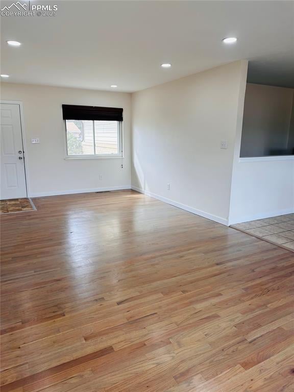 empty room with light wood-type flooring