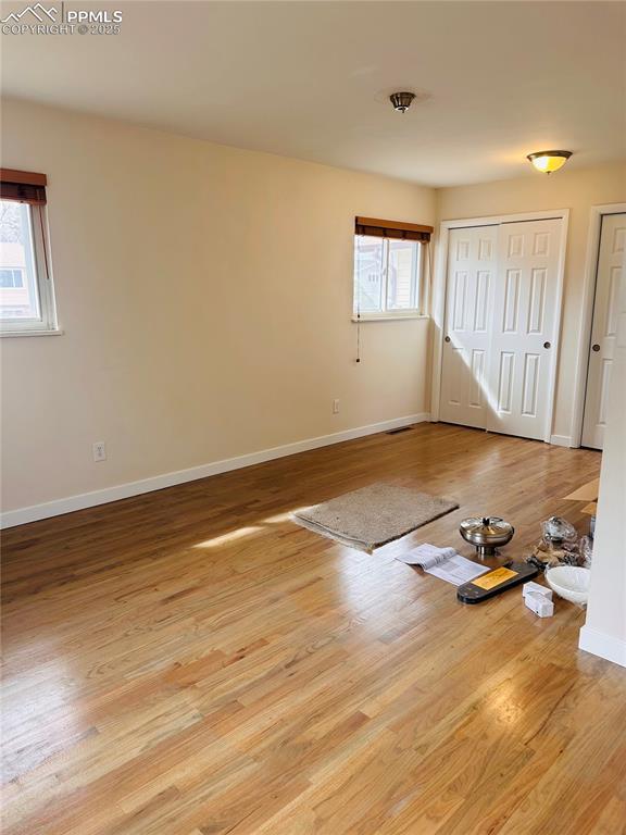 spare room featuring light hardwood / wood-style flooring