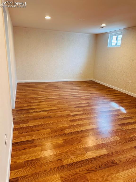 basement featuring hardwood / wood-style flooring