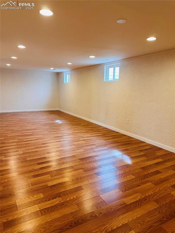 basement featuring hardwood / wood-style flooring