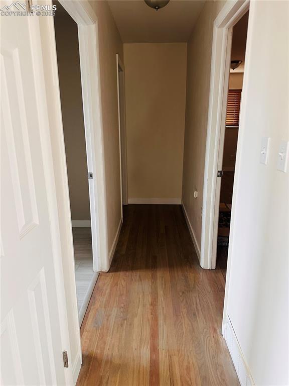 hall with light wood-type flooring