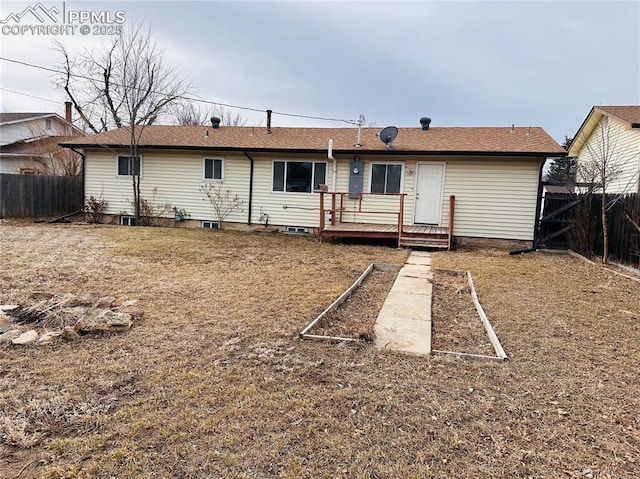 back of house featuring a deck