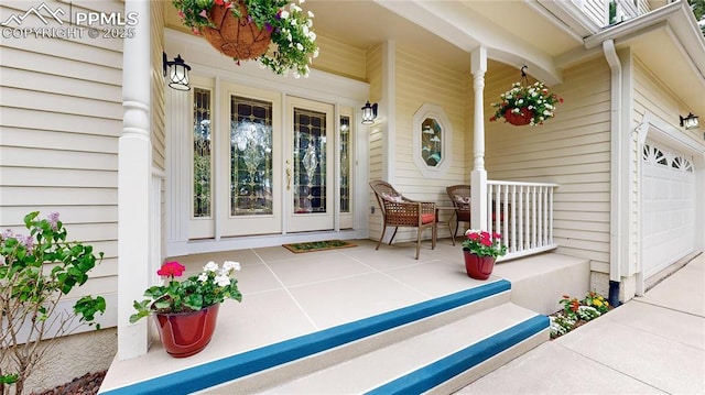 property entrance with a garage and a porch