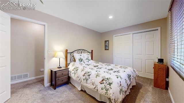 bedroom with a closet and carpet flooring