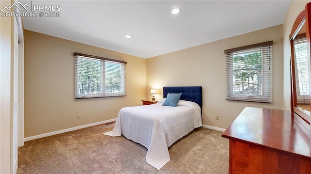 bedroom featuring light carpet