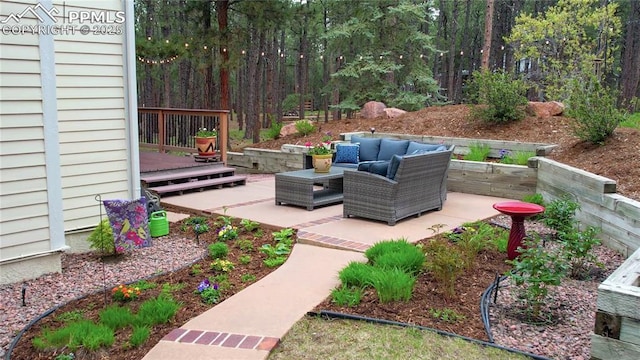 view of patio / terrace with a wooden deck and an outdoor hangout area