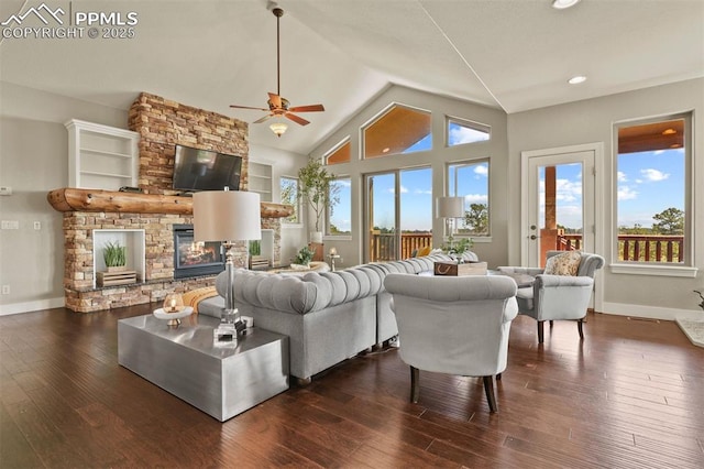 living room with high vaulted ceiling, dark hardwood / wood-style floors, and a stone fireplace