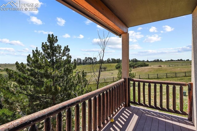 wooden deck featuring a rural view