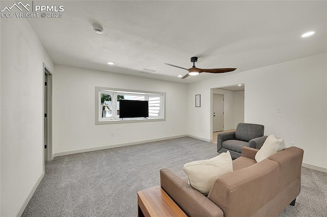living area with baseboards, recessed lighting, and light colored carpet