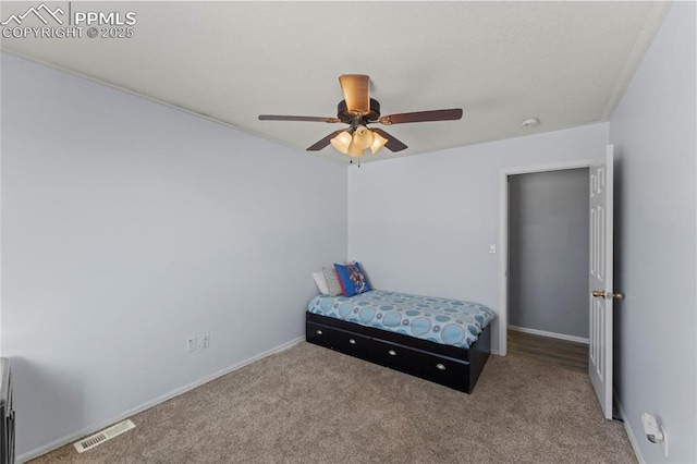 carpeted bedroom featuring ceiling fan