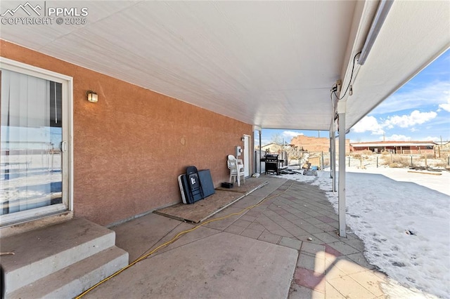 view of snow covered patio