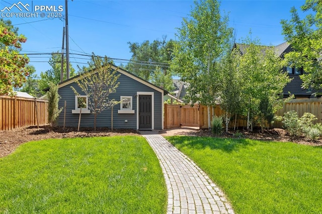 view of front of property with a front yard and a fenced backyard