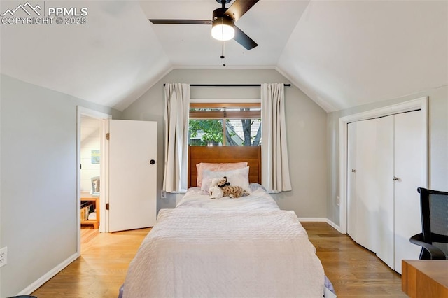 bedroom with lofted ceiling, ceiling fan, baseboards, and light wood-style floors