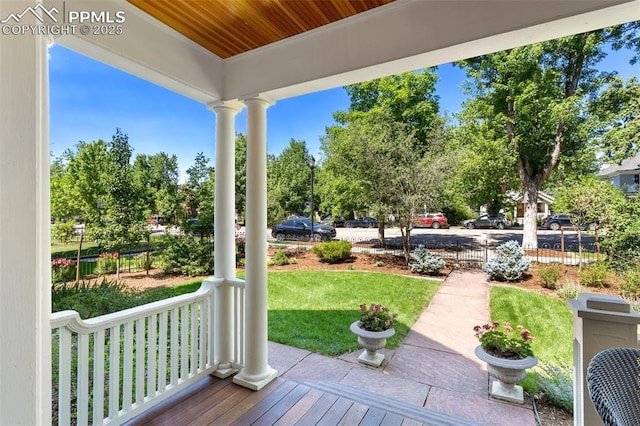 exterior space featuring a porch and a lawn