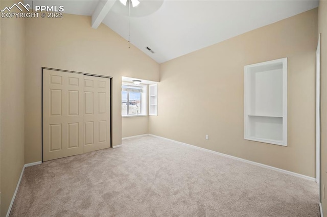 unfurnished bedroom with carpet floors, visible vents, baseboards, a closet, and beam ceiling