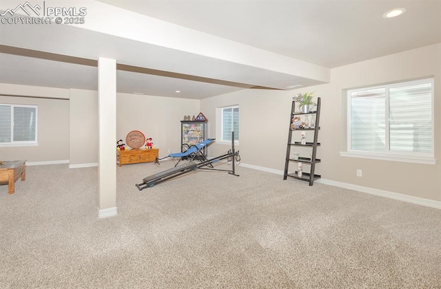 exercise area featuring recessed lighting, carpet flooring, and baseboards