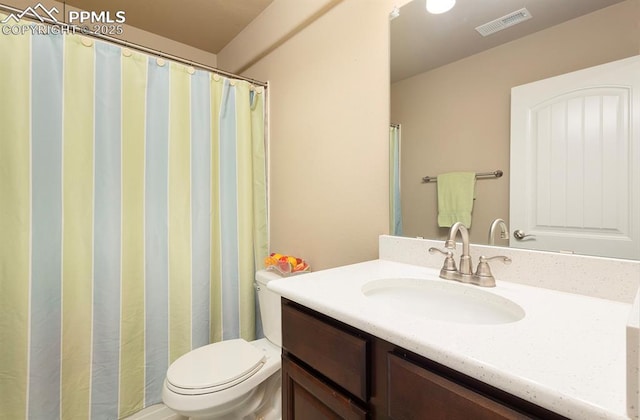 full bath with visible vents, vanity, and toilet