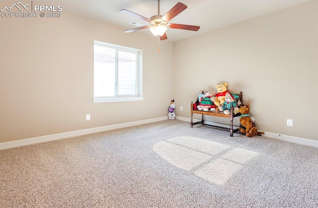 playroom with ceiling fan, carpet flooring, and baseboards